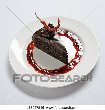 Slice of chocolate cake on dessert plate adorned with a red chili pepper. View Large Photo Image Stock Photograph - Slice of chocolate cake on dessert plate adorned with a red chili pepper.. Fotosearch