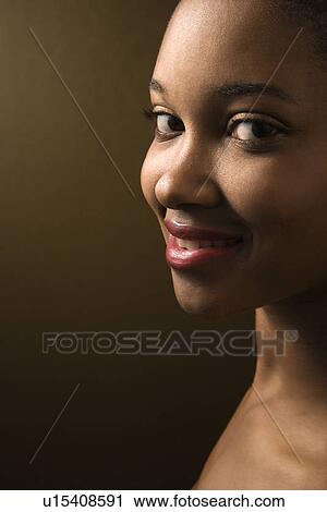 Smiling female looking at viewer View Large Photo Image Stock Image - Smiling female looking at viewer. Fotosearch