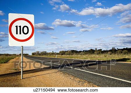 Speed limit kilometer per hour road sign by road in rural Australia. View Large Photo Image Picture - Speed limit kilometer per hour road sign by road in rural Australia.. Fotosearch