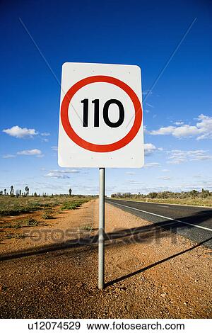 Speed limit kilometer per hour road sign by road in rural Australia. View Large Photo Image Stock Photo - Speed limit kilometer per hour road sign by road in rural Australia.. Fotosearch