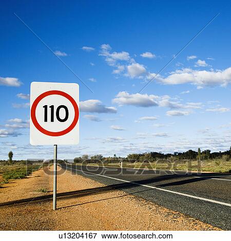 Stock Photo - Speed limit kilometer per hour road sign by road in rural Australia.. Fotosearch