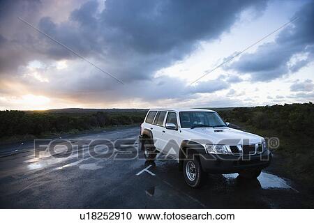 Stock Image - Sport utility vehicle parked on Great Ocean Road in Australia. Fotosearch