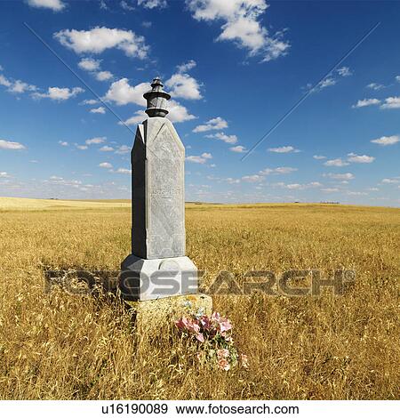 Stock Photo - Stone burial monument in field.. Fotosearch