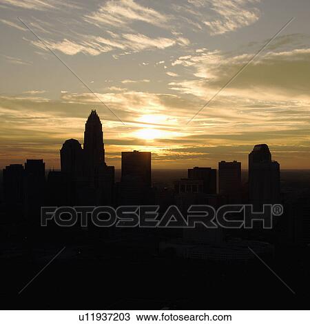 Sunset silhouetting aerial view of Charlotte, North Carolina city skyline. View Large Photo Image Stock Image - Sunset silhouetting aerial view of Charlotte, North Carolina city skyline.. Fotosearch