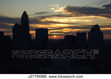 Sunset silhouetting aerial view of Charlotte, North Carolina city skyline. View Large Photo Image Stock Photograph - Sunset silhouetting aerial view of Charlotte, North Carolina city skyline.. Fotosearch