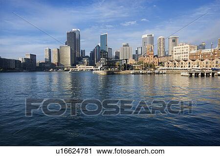 Stock Image - Sydney Cove with view of downtown skyline and water in Sydney, Australia. Fotosearch