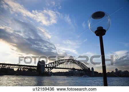 Sydney Harbour, Australia, with view of Sydney Harbour bridge and lamppost. View Large Photo Image Stock Photograph - Sydney Harbour, Australia, with view of Sydney Harbour bridge and lamppost.. Fotosearch