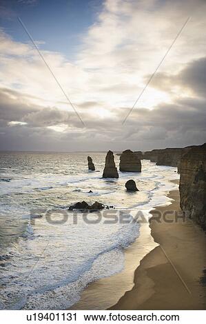Stock Image - Twelve Apostles rock formation on coastline as seen from the Great Ocean Road, Australia. Fotosearch