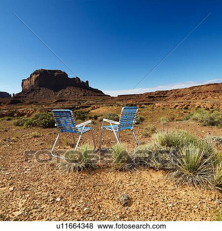 Two lawn chairs in scenic desert landscape with butte landformation. View Large Photo Image Stock Photo - Two lawn chairs in scenic desert landscape with butte landformation.. Fotosearch