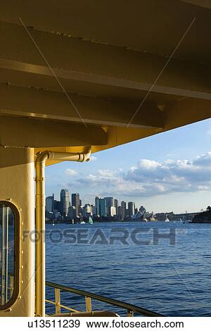 Stock Photo - View from ferryboat of harbour and skyline of Sydney, Australia. Fotosearch