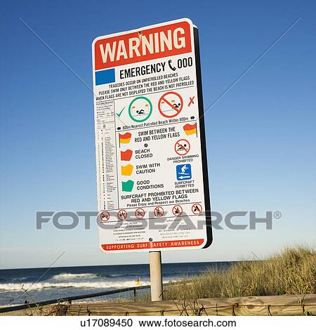 Stock Image - Warning for unpatrolled beach sign on Surfers Paradise, Australia.. Fotosearch