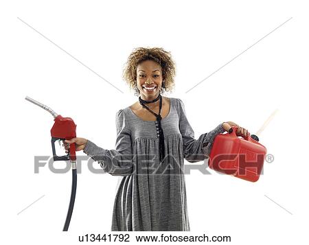 Woman holding fuel pump nozzle and gas storage container View Large Photo Image Stock Image - Woman holding fuel pump nozzle and gas storage container. Fotosearch