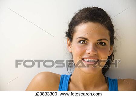 Woman in fitness attire smiling View Large Photo Image Stock Image - Woman in fitness attire smiling. Fotosearch