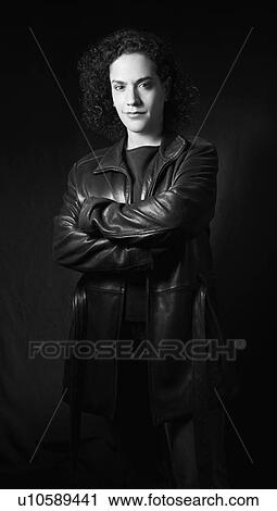 Woman in leather jacket with arms crossed looking at viewer. View Large Photo Image Stock Image - Woman in leather jacket with arms crossed looking at viewer.. Fotosearch