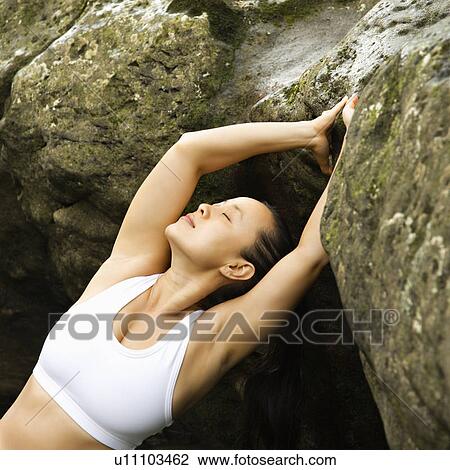 Woman leaning back on boulder in Maui, Hawaii View Large Photo Image Stock Image - Woman leaning back on boulder in Maui, Hawaii. Fotosearch