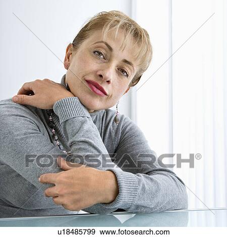 Stock Photo - Woman looking at viewer. Fotosearch