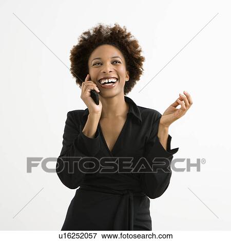 Stock Photo - Woman talking on cellphone smiling . Fotosearch
