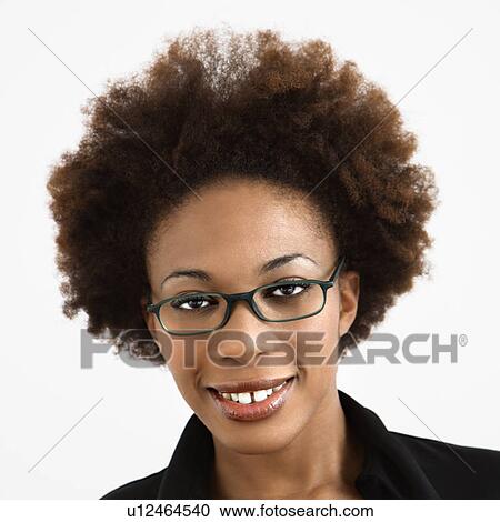 Woman with afro wearing eyeglasses View Large Photo Image Stock Image - Woman with afro wearing eyeglasses . Fotosearch