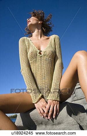 Young adult Caucasian female in transparent shirt looking up. View Large Photo Image Stock Photography - Young adult Caucasian female in transparent shirt looking up.. Fotosearch