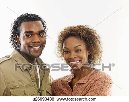 Stock Photo - Young attractive couple smiling.. Fotosearch