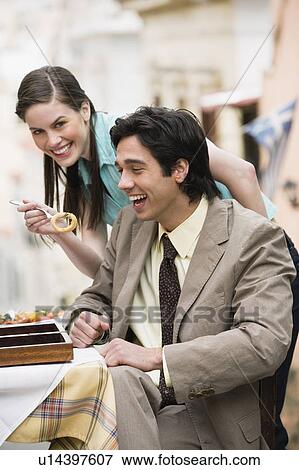 Business couple at taverna View Large Photo Image Stock Photo - Business couple at taverna. Fotosearch