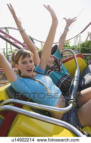 Teenage couple on amusement park ride View Large Photo Image Picture - Teenage couple on amusement park ride. Fotosearch