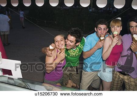 Teenagers eating ice cream View Large Photo Image Stock Image - Teenagers eating ice cream. Fotosearch