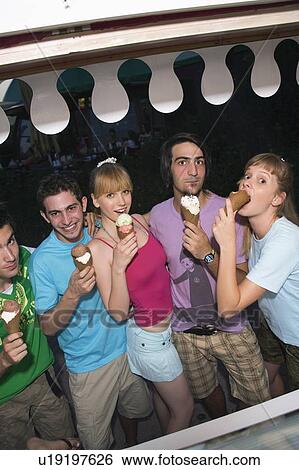 Teenagers eating ice cream View Large Photo Image Stock Photograph - Teenagers eating ice cream. Fotosearch