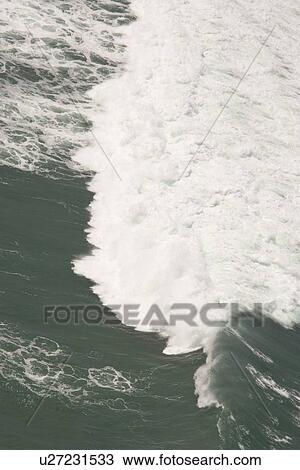 Stock Image - Aerial of surf breaking. Cape Peninsular, South Africa. Fotosearch