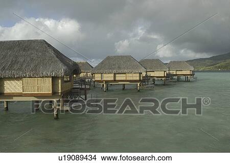 Beach apartments at Tahaha 5 star resort, Raiatia, French Polynesia, Southern Pacific Ocean View Large Photo Image Picture - Beach apartments at Tahaha 5 star resort, Raiatia, French Polynesia, Southern Pacific Ocean. Fotosearch