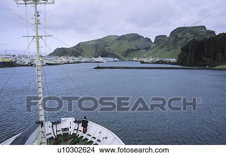 Entrance to the harbour of Heimaey. Vestmannaeyjar Islands, Southern Iceland View Large Photo Image Picture - Entrance to the harbour of Heimaey. Vestmannaeyjar Islands, Southern Iceland. Fotosearch