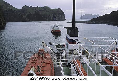 Entrance to the harbour of Heimaey. Vestmannaeyjar Islands, Southern Iceland View Large Photo Image Stock Image - Entrance to the harbour of Heimaey. Vestmannaeyjar Islands, Southern Iceland. Fotosearch