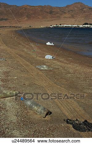 Plastic litters a public beach in Egypt. When we learn to stop throwing our rubbish in the sea. Egypt View Large Photo Image Picture - Plastic litters a public beach in Egypt. When we learn to stop throwing our rubbish in the sea. Egypt . Fotosearch