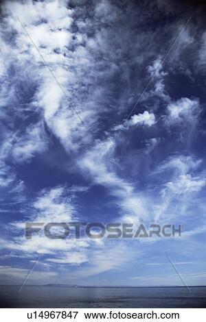 Stock Photo - Seascape and cloud formations looking to the west from coast of Iceland.. Fotosearch