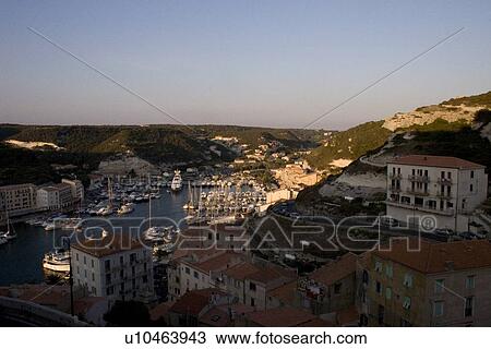 Stock Image - Sun set on the habour in Bonifacio, Corsica. Fotosearch