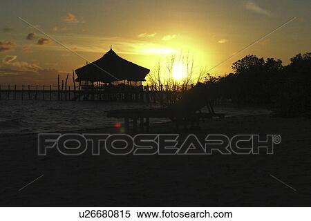 Stock Photography - Sunset falling behind the sunset bar. Fundo lagoon. Pemba. Tanzania, East Africa. Fotosearch