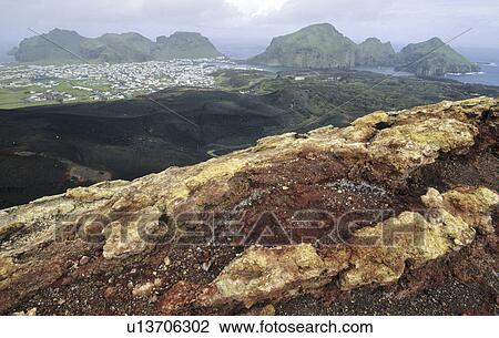 View from the Volcano Eldfell down to the settlement Heimaey. Vestmannaeyjar Islands, Southern Iceland View Large Photo Image Stock Image - View from the Volcano Eldfell down to the settlement Heimaey. Vestmannaeyjar Islands, Southern Iceland. Fotosearch