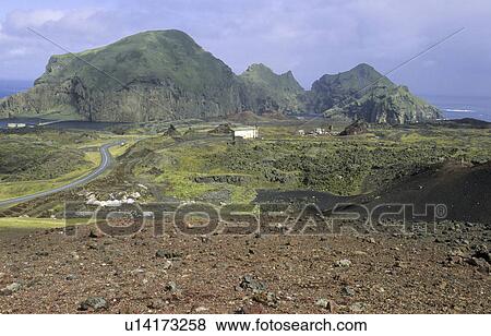 View from the Volcano Eldfell down to the settlement Heimaey. Vestmannaeyjar Islands, Southern Iceland View Large Photo Image Stock Photo - View from the Volcano Eldfell down to the settlement Heimaey. Vestmannaeyjar Islands, Southern Iceland. Fotosearch