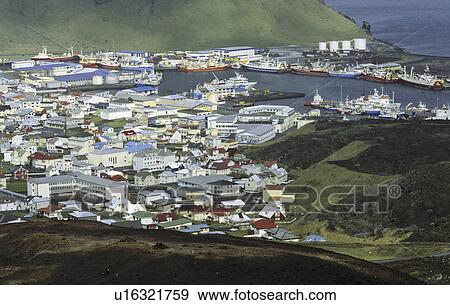 Stock Photo - View from the Volcano Eldfell down to the settlement Heimaey. Vestmannaeyjar Islands, Southern Iceland. Fotosearch