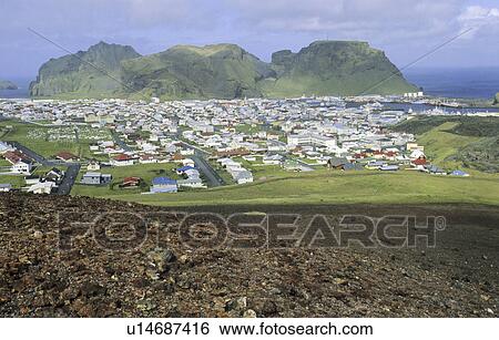 View from the Volcano Eldfell down to the settlement Heimaey. Vestmannaeyjar Islands, Southern Iceland View Large Photo Image Stock Photograph - View from the Volcano Eldfell down to the settlement Heimaey. Vestmannaeyjar Islands, Southern Iceland. Fotosearch
