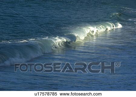 Stock Photography - Wave breaking in Waimea Bay Beach Park, North shore, Oahu, Hawaii, USA. Fotosearch