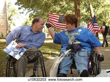 Activists, both with physical disabilities, at a Freedom Rally advocating for civil rights for people with disabilities View Large Photo Image Stock Image - Activists, both with physical disabilities, at a Freedom Rally advocating for civil rights for people with disabilities. Fotosearch