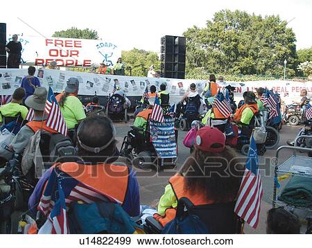 Stock Photo - Crowd of people with disabilities (many utilizing wheelchairs for mobility) attending the ADAPT March on Washington to advocate for the civil rights of people with disabilities.. Fotosearch