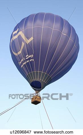 Hot air balloon featuring an accessible basket which allows people with disabilities to ride in the balloon. View Large Photo Image Stock Photo - Hot air balloon featuring an accessible basket which allows people with disabilities to ride in the balloon.. Fotosearch