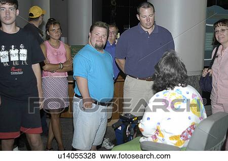 Man with DownÆs Syndrome talking with people with and without disabilities. View Large Photo Image Stock Photo - Man with DownÆs Syndrome talking with people with and without disabilities.. Fotosearch
