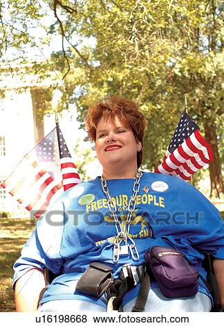 Woman with chains around her neck to symbolize the incarceration of people with disabilities in institutions. View Large Photo Image Stock Photo - Woman with chains around her neck to symbolize the incarceration of people with disabilities in institutions.. Fotosearch