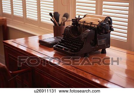 Stock Image - Antique Typewriter Near Window. Fotosearch