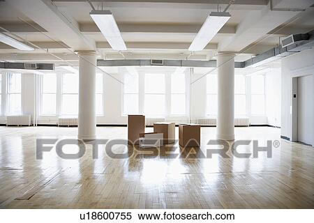 Cardboard boxes in empty room View Large Photo Image Stock Photography - Cardboard boxes in empty room. Fotosearch