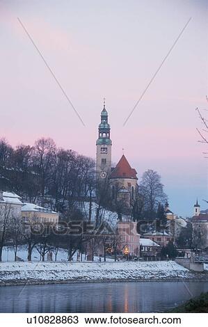 Stock Image - Church By River In Winter. Fotosearch
