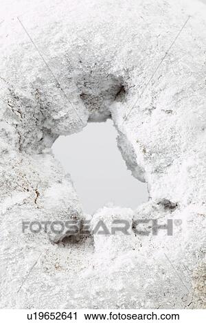 Stock Image - Donut with icing sugar (close-up). Fotosearch